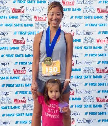 On Sunday November 14, Homestead and Keys Gate resident Asuka Barkley entered the First State Bank Key Largo Bridge Run dedicating her effort to her husband, Air Force Master Sergeant CJ Barkley who is currently stationed in Korea. Asuka won the Gold Medal in her division while pushing their two year old daughter Mia in a stroller for the entire 5 K. It was an extra ordinary effort especially appropriate during Veterans Day weekend.